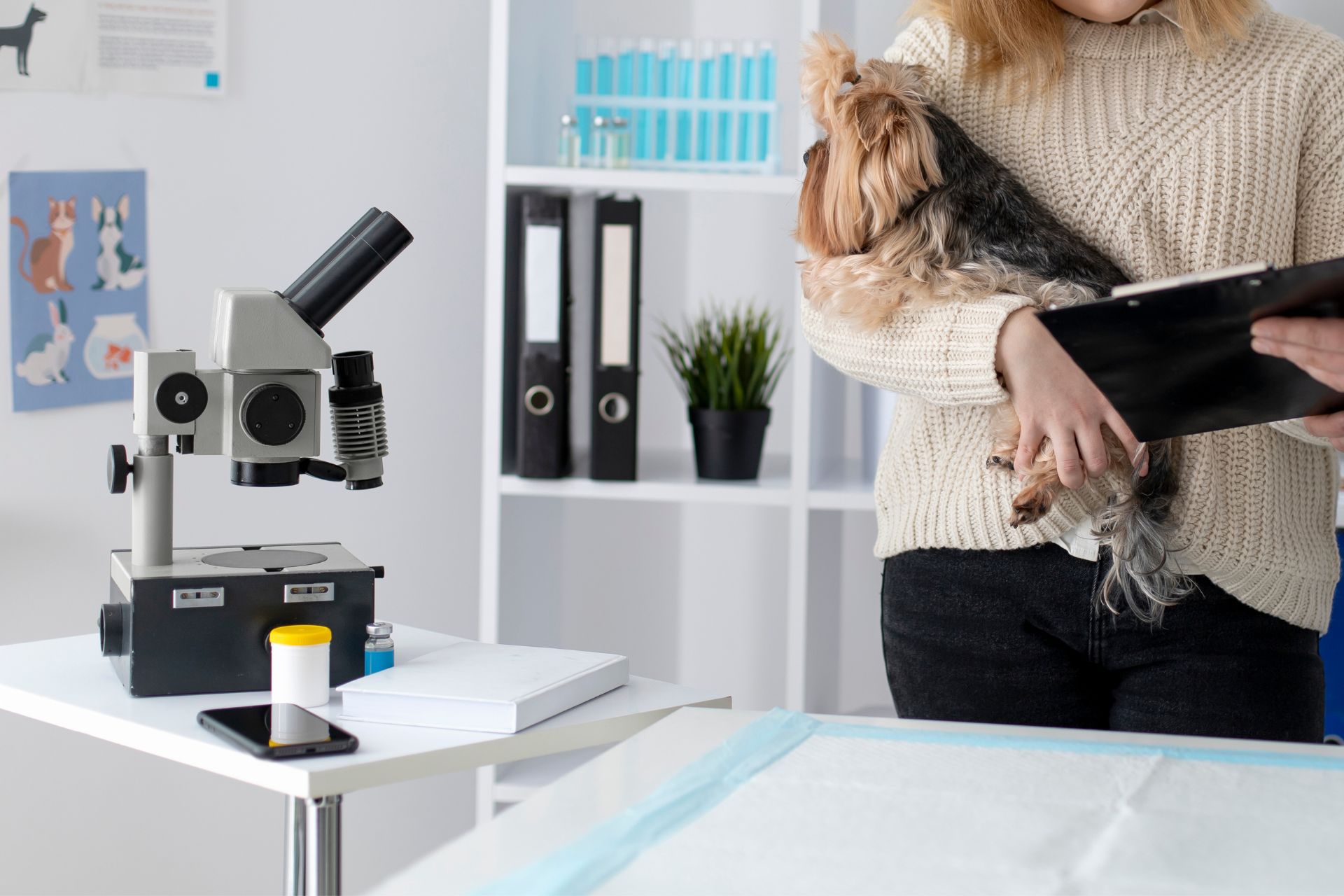 microscope and waman with her dog